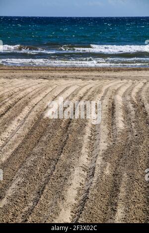 Sand beanspruchte Textur auf den Strand am Morgen Stockfoto