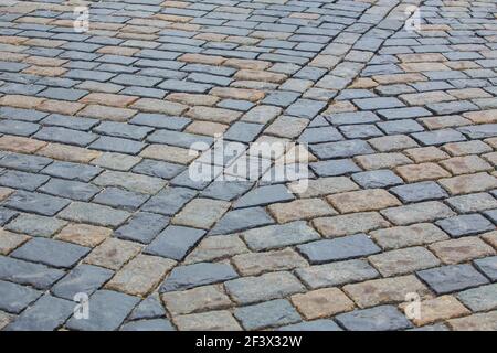 Abstrakter Hintergrund. Alte Pflastersteinpflaster Nahaufnahme. Stockfoto