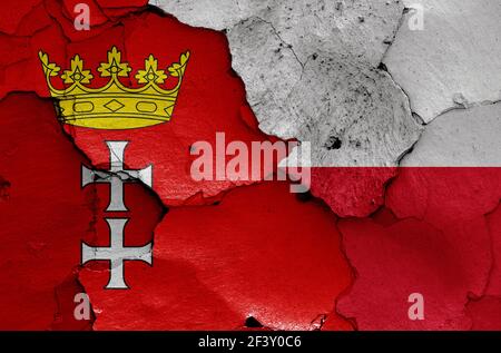 Flaggen von Danzig und Polen auf rissige Wand gemalt Stockfoto