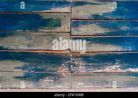 Blau bemalte Holzstruktur Hintergrund. Alte bemalte Holzwand. Bemalte Planken des Zauns. Blau bemalte Holzstruktur Hintergrund. Stockfoto