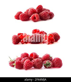 Himbeeren und rote Johannisbeeren isoliert auf weißem Hintergrund. Rote Beeren aus der Nähe. Saftige und leckere Himbeeren. Hintergrund von Himbeeren. Hintergrund Stockfoto