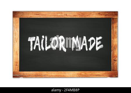 TAILOR MADE Text auf schwarzem Holzrahmen Schule Tafel geschrieben. Stockfoto