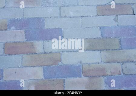 Street Backstein Muster mit verschiedenen Farben Hintergrund Stockfoto