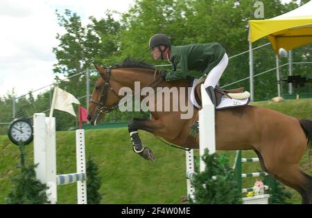 Kanada 1, Spruce Meadows Juni 2002, Raymond Texel (USA) Reiten Pershing Stockfoto