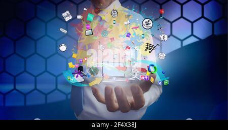 Aufbau eines Netzwerks von digitalen Symbolen mit Laptop über der Hand Des Geschäftsmannes Stockfoto