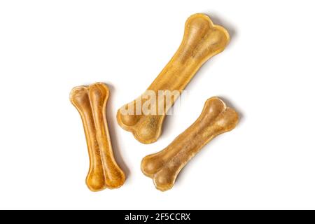 Knochen für Hunde isoliert auf weißem Hintergrund Draufsicht Flat Lay Delicious Leckerbissen für Ihr geliebtes Haustier Futter für Tiere Konzept. Stockfoto