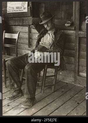 Mann sitzt. Arthur Rothstein (Amerikanisch, 1915 - 1985) Stockfoto