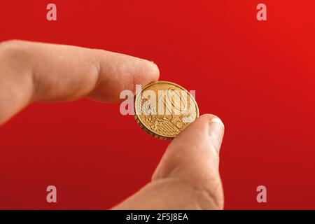 Yen-Euro-Cent-Münze Nahaufnahme in der Hand des Mannes Stockfoto