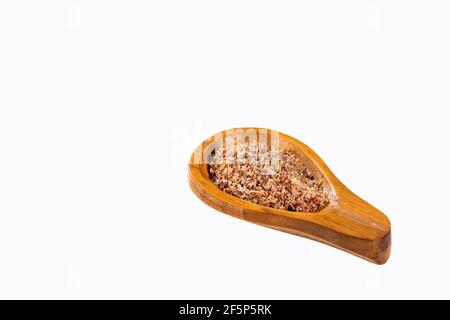 Zerkleinerte Leinsamen in Holzlöffel - Linum usitatissimum Stockfoto