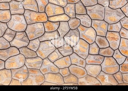 Faux Kopfsteinpflasterwand in einem historischen Gebäude in Peking, China. Stockfoto