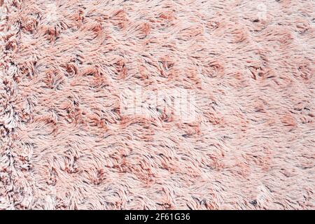 Nahaufnahme Plüsch Textil rosa abstrakten Hintergrund. Stoffstruktur. Stockfoto