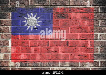 Taiwan-Flagge auf einem Backstein Wand Hintergrund Stockfoto