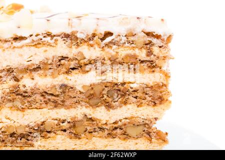 Leckerer Kuchen mit Walnüssen und Mandeln. Makro. Foto kann als ganzer Hintergrund verwendet werden. Stockfoto