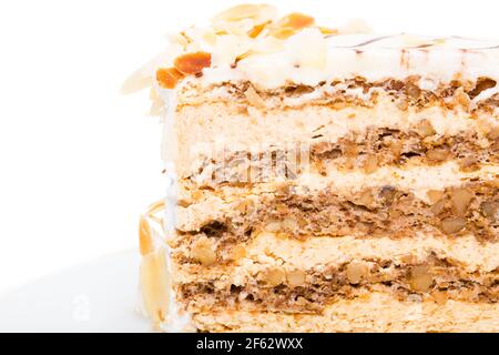 Leckerer Kuchen mit Walnüssen und Mandeln. Makro. Foto kann als ganzer Hintergrund verwendet werden. Stockfoto