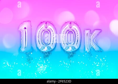 Silberne Zahl Ballons 100K Stockfoto
