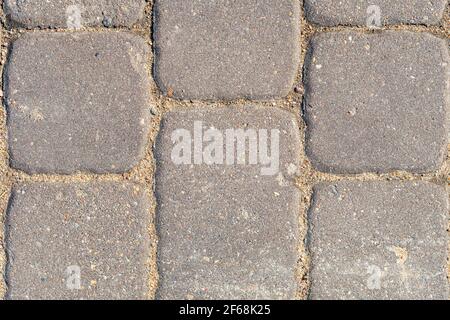 Pflasterplatten aus der Nähe, Textur von Beton Pflasterstein, Stein Hintergrund Stockfoto