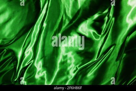 Abstrakter Hintergrund in rot und orange Seide oder Satin Luxus Stoff Textur Stockfoto