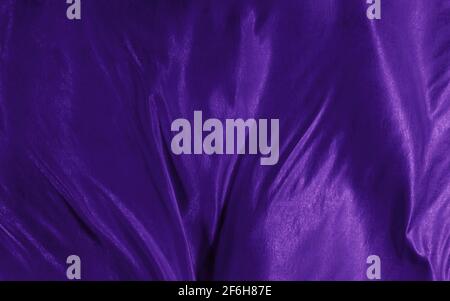 Abstrakter Hintergrund violette Seide oder Satin Luxus Stoff Textur Stockfoto