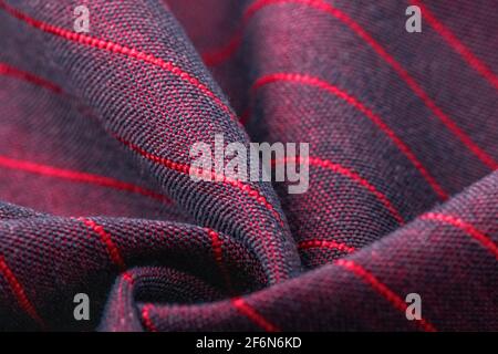 Textur, Hintergrund, Vorlage. Seide andere Baumwollstoff schwarz und rot, Seide andere Baumwollvorwäsche. In Nahaufnahme, Fäden aus Stoff und ein Muster aus Textu Stockfoto