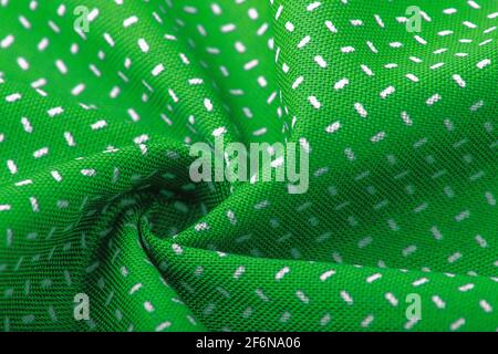 Textur, Hintergrund, Vorlage. Seide andere Baumwolle Stoff grüne Farbe, Seide andere Baumwolle Vorhänge. In Nahaufnahme, Fäden aus Stoff und ein Muster von Textur Stockfoto