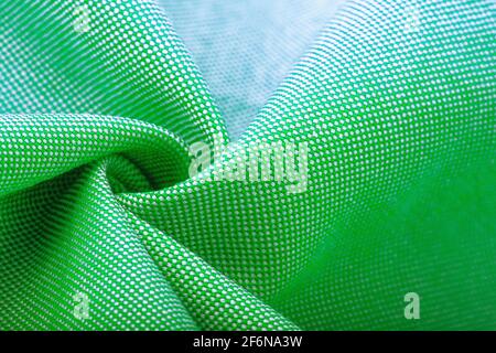 Textur, Hintergrund, Vorlage. Seide andere Baumwolle Stoff grüne Farbe, Seide andere Baumwolle Vorhänge. In Nahaufnahme, Fäden aus Stoff und ein Muster von Textur Stockfoto