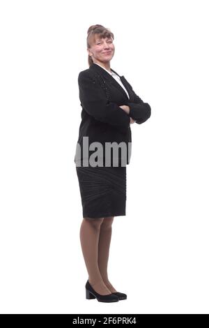 In voller Länge, Seitenansicht einer selbstbewussten jungen Geschäftsfrau, die mit gefalteten Händen steht Stockfoto