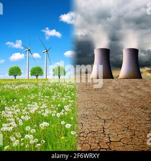 Kühltürme eines Kernkraftwerks in einer verwüsteten Landschaft und Windturbinen auf einer Wiese. Konzept der sauberen und umweltschädlichen Energieerzeugung. Stockfoto