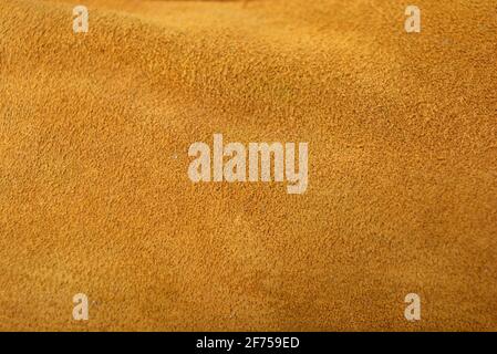 Brauner Hintergrund aus echtem Leder, natürliches Wildleder. Stockfoto