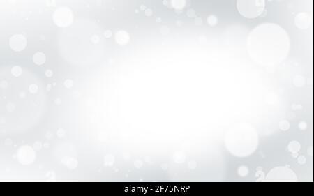 Defokussiert weiße Lichter auf grauem Hintergrund. Abstraktes Bokeh auf weißem Hintergrund. Glänzender und schimmernder Hintergrund. Stockfoto
