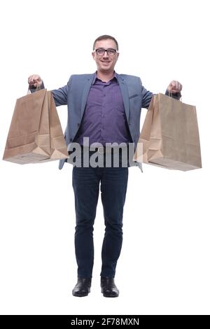 Gut aussehender junger Mann, der Einkaufstaschen hält Stockfoto