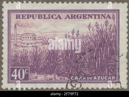Briefmarke der philatelistischen Motivsammlung von Gösta Bodman, begann 1950.die Briefmarke aus Argentinien, 1935. Motive der Rohrplantage. Zuckerverwendung im Hintergrund. Stockfoto