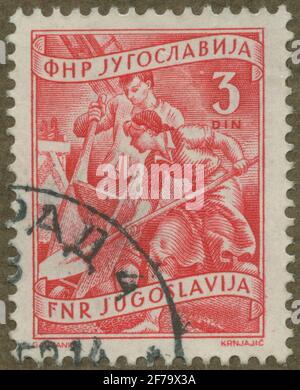 Briefmarke der Gösta Bodman's Philatelist Association, begann 1950.die Briefmarke aus Jugoslawien, 1950. Bewegungen von Bauarbeitern. Stockfoto