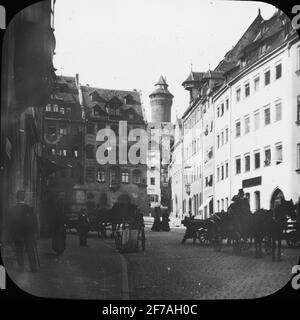 SkiopT-Ikone mit Motiven aus der Nürnberger Straße. Das Bild wurde auf Karton mit der Aufschrift Spring Travel 1910 Nürnberg 9 gespeichert. XV. Stockfoto