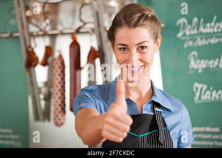 Porträt von auftauchend Thumbs bei Metzgerei Metzger Stockfoto