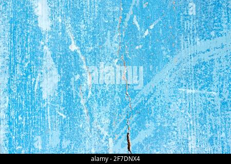 Verwitterte und zerkratzte alte, blau lackierte Holzbretter. Stockfoto