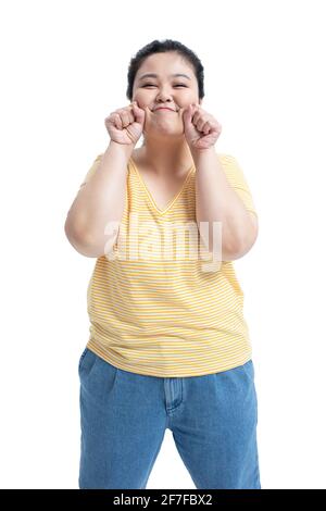 Junge Frau, die niedlich wirkt Stockfoto