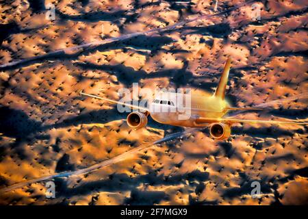 Flugzeug über der Wüste bei Sonnenuntergang im Nahen Osten Stockfoto