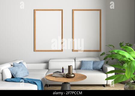 Zwei vertikale leere Poster sind an der weißen Wand im Inneren des modernen Wohnzimmers zu sehen Stockfoto