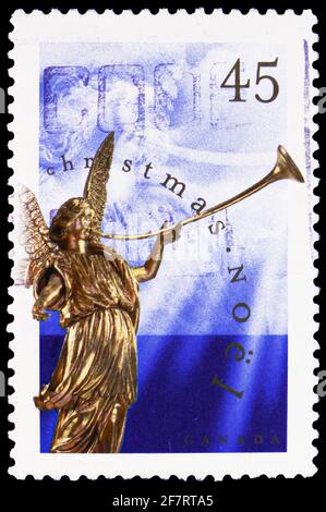 MOSKAU, RUSSLAND - 17. JANUAR 2021: In Kanada gedruckte Briefmarke zeigt Engel des Jüngsten Gerichts, Weihnachten (1998), Engelstatuen Serie, um 199 Stockfoto