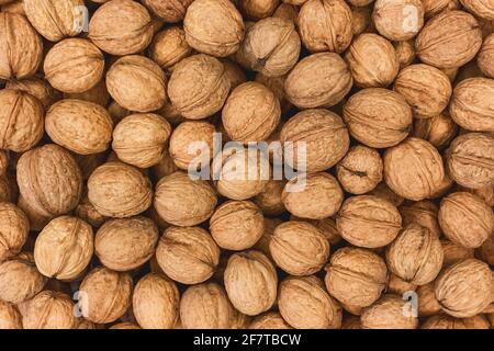 Walnüsse Zutat Textur, Haufen von Nüssen Lebensmittel Snack Hintergrund. Stockfoto