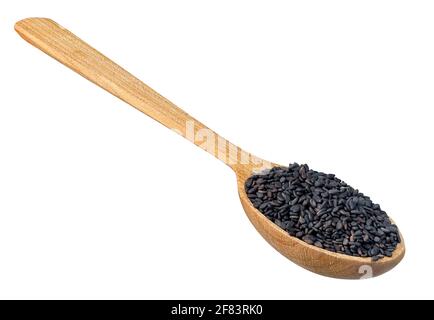 Trockene schwarze Sesamsamen in Holzlöffel Stockfoto
