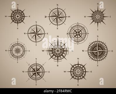 Set von Kompassrose oder Windrose auf braunem Jahrgang Hintergrund Stock Vektor