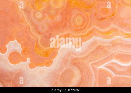 Super exotischer orangefarbener Onyx-Hintergrund in stilvoller Farbe, natürlicher Textur für Ihren einzigartigen Interior-Look. Stockfoto