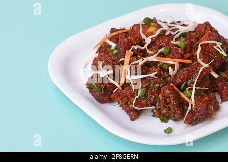 Paneer Tikka Kabab in roter Sauce - ist ein indisches Gericht aus Stücken von Quark in Gewürzen mariniert, Chili Paneer Kabab, würzigen Quark Stockfoto