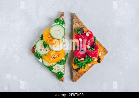 Vegetarisch vs. Fleischessen. Zwei Diätarten Sandwiches Stockfoto