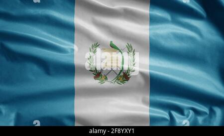 Guatemaltekische Flagge winkt im Wind. Nahaufnahme des Guatemala-Banners, weiche und glatte Seide. Stoff Stoff Textur Fähnrich Hintergrund. Stockfoto