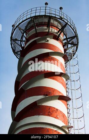 Modern gas power station. Smocking stack on blue sky background. Red lights on top, close-up. Uralsk city, Kazakhstan Stockfoto