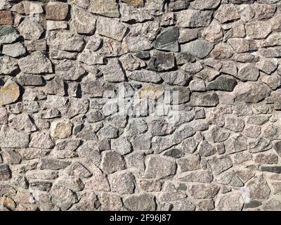 Hintergrund großer Steine Wandtextur mit verschiedenen Farben Steine Stockfoto