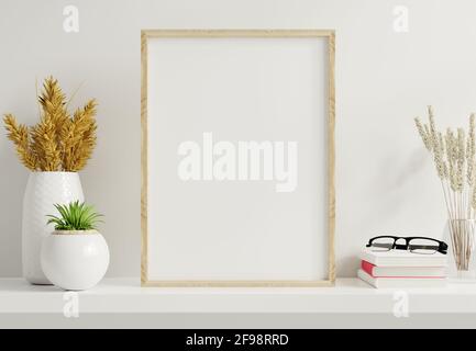 Heim Innenausstatter Modell mit vertikalem Goldrahmen mit Zierpflanzen in Töpfen auf leerem Wandhintergrund.3D-Rendering Stockfoto