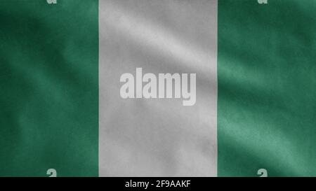 Nigrische Flagge winkt im Wind. Nahaufnahme von Nigeria Banner weht, weiche und glatte Seide. Stoff Stoff Textur Fähnrich Hintergrund. Stockfoto